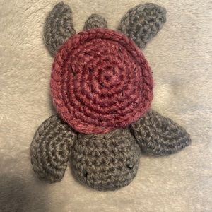 This is a homemade crochet watermelon turtle it is green and pink